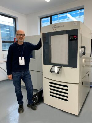Service engineer doing a preventative maintenance contract on a product test chamber
